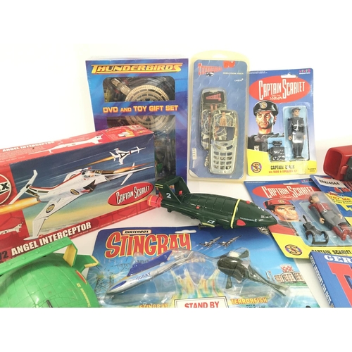 80 - A Collection of Thunderbirds. Captain Scarlet and Stingrays Carded Figures. A DVD Gift Set. Etc.