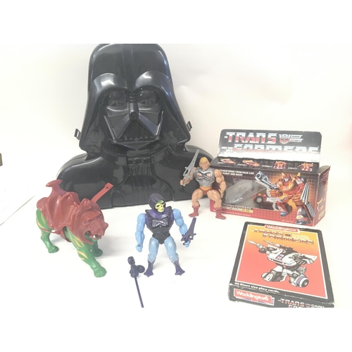 806 - A Collection of 80s Toys including Darth Vader Carry Case. He Man and Transformers. (2).