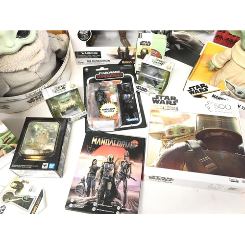 859 - A Collection of Star Wars The Mandalorian Toys.including A Nerf Gun. Puzzles. figures Etc.