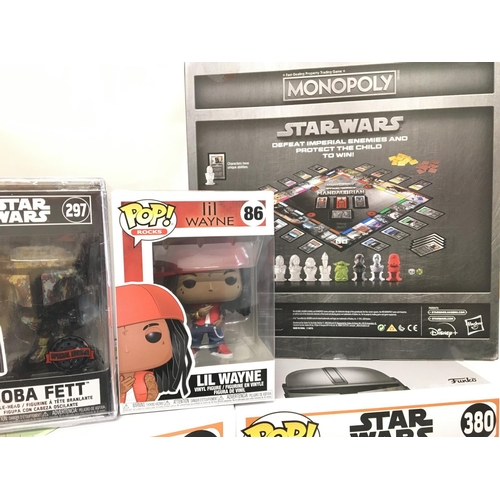 860 - A Collection of Funko Pop Figures and. Star Wars Monopoly.