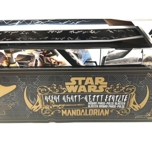 862 - A Boxed Star Wars the Mandalorian Amban Phase-Pulse Blaster And a DarkSaber. Both boxed.(2).