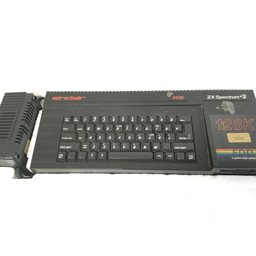 906 - A Boxed Sinclair ZX Spectrum 128+3 and a Collection of Various Games on cassette.