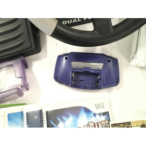 93 - A Box Containing A Nintendo Wii. Games. A PlayStation light gun. A Game Boy advance etc.(2)