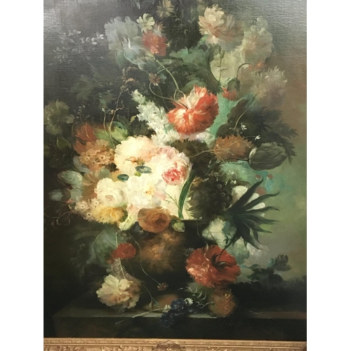 100 - A large gilt framed oil painting on canvas still life study of a profusion of flowers signed by the ... 