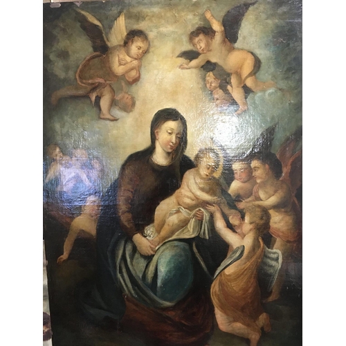 39 - An unframed oil painting on canvas of the Madonna and child with numerous cherubs. Unsigned and an u... 