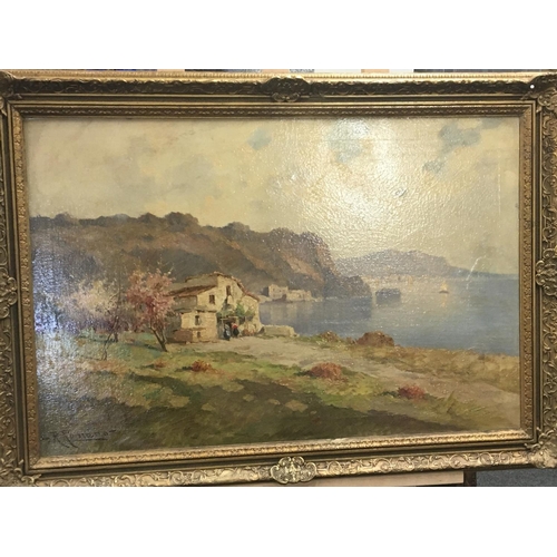 84 - A framed oil painting. A distant study of the bay of Naples with traditional buildings. Signed by th... 