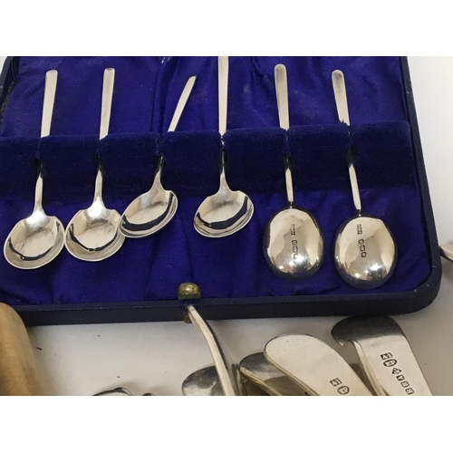 834 - A collection of silver plated cutlery a cased set of silver coffee spoons and a silver plated wine c... 