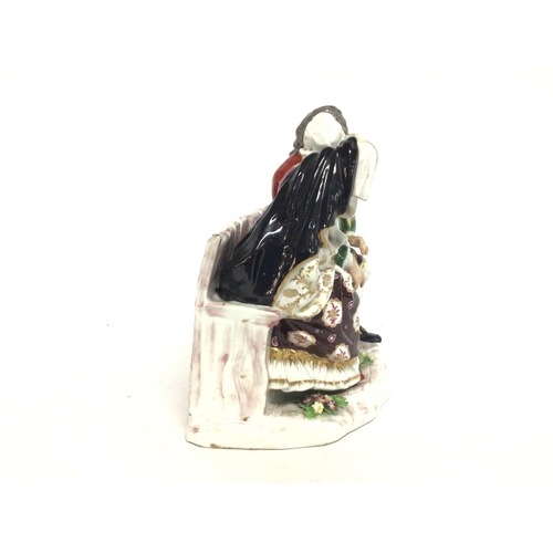 1113 - A large Derby Porcelain group figure of a gentleman and lady sitting on a bench, 14x22x20cm approxim... 