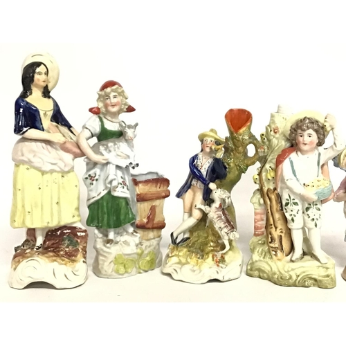 1119 - A collection of Staffordshire figures and other, ranging from heights of 15 to 23cm tall. postage ca... 