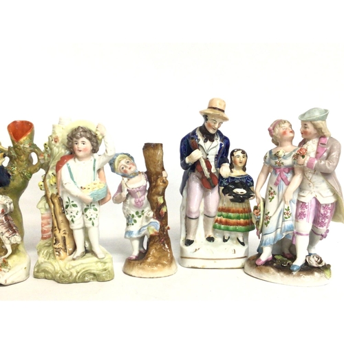 1119 - A collection of Staffordshire figures and other, ranging from heights of 15 to 23cm tall. postage ca... 