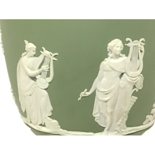 1148 - A Wedgwood neo-classical green Jasper urn, 27cm tall approximately. Postage cat D