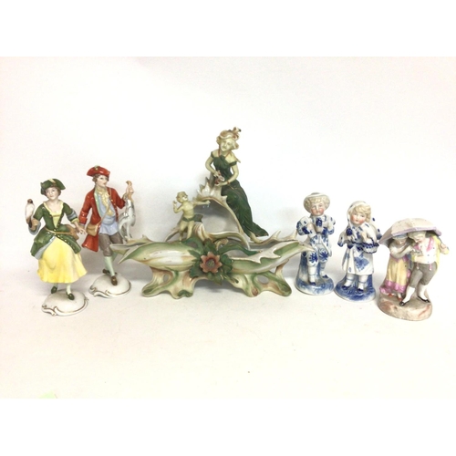 1149 - A collection of early 20th century ceramic figures and a centre piece including Rosenthal German por... 