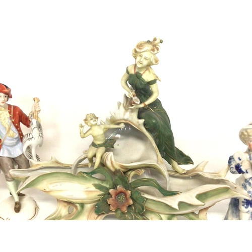 1149 - A collection of early 20th century ceramic figures and a centre piece including Rosenthal German por... 