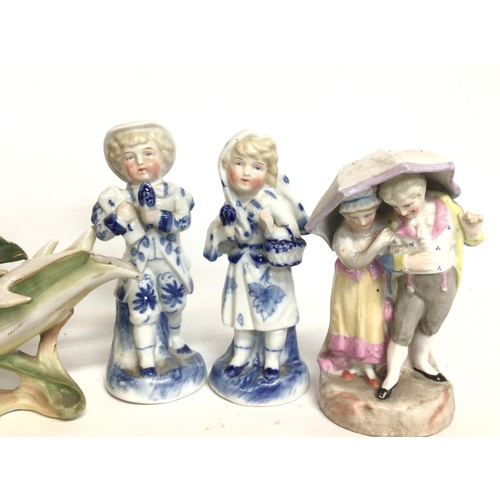 1149 - A collection of early 20th century ceramic figures and a centre piece including Rosenthal German por... 