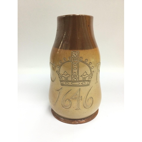 1160 - A Doulton tankard reproduced in the style of a 1646 tankard, approx 20cm. Shipping category D.