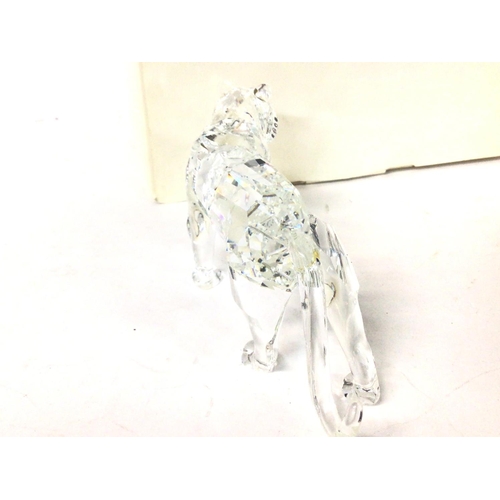 1186 - A boxed Swarovski tiger, no obvious signs of damage /restoration . Postage cat d