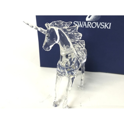 1216 - Boxed Swarovski unicorn figurine ,postage cat D no signs of obvious damage/ restoration