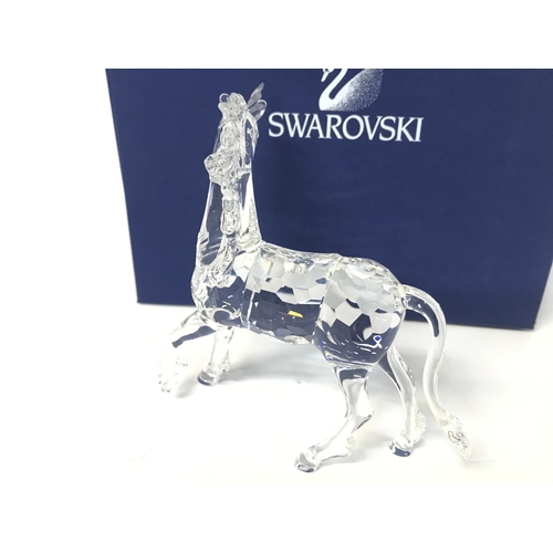 1216 - Boxed Swarovski unicorn figurine ,postage cat D no signs of obvious damage/ restoration