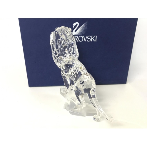 1217 - Boxed Swarovski lion standing on a rock, postage cat D no signs of obvious damage/ restoration