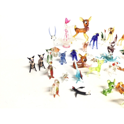 1258 - A collection of various glass figurines. Postage D