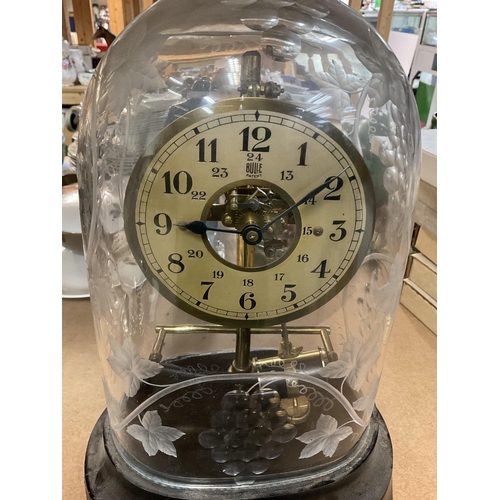 1276 - A Bulle electric mantle clock under a glass engraved dome .