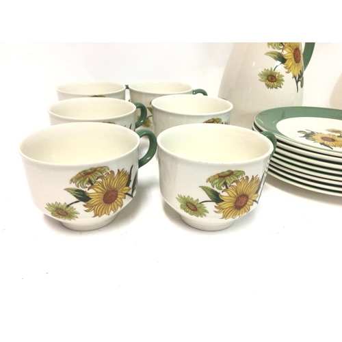 1299 - A Wedgwood sunflower pattern tea set. There is a small chip to one cup and a small chip to two of th... 