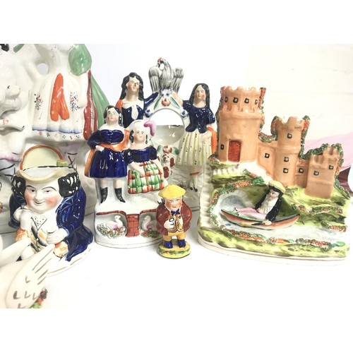 1300 - A large collection of Staffordshire porcelain figures consisting of Little Red Riding hood, Robin Ho... 