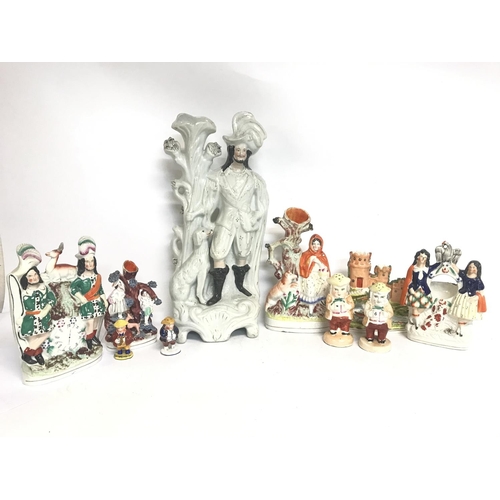 1300 - A large collection of Staffordshire porcelain figures consisting of Little Red Riding hood, Robin Ho... 