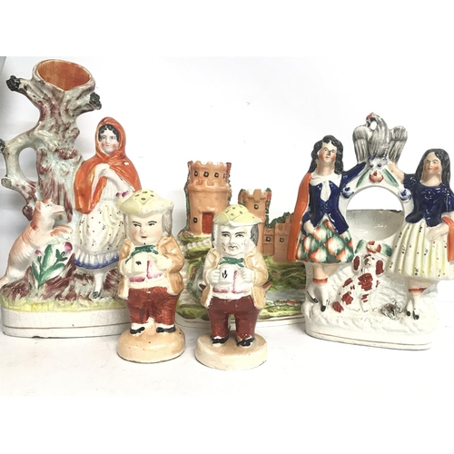 1300 - A large collection of Staffordshire porcelain figures consisting of Little Red Riding hood, Robin Ho... 