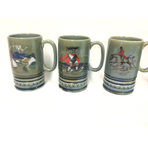 1304 - A collection of five musical mugs. No chips or cracks observed. Postage D