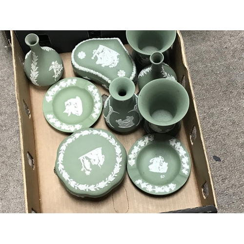 1326 - Two boxes of green wedgwood including vases, lidded trinket boxes etc. No obvious damage