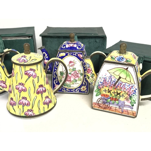 1331 - Enamel hand painted Trade Aid collectable small tea pots , approximately 9cm tall. No obvious signs ... 