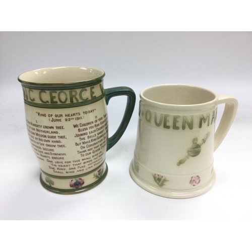 1365 - Two Moorcroft King George V coronation mugs comprising one with patriotic hymn text. Approx heights ... 