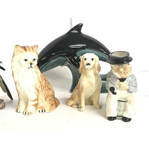 1389 - A collection of ceramic figures , including Beswick cat, Poole dolphin, Ceramic chicken etc postage ... 