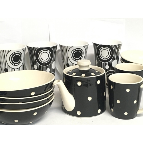 1402 - A collection of ceramics including a T.G Green tea set and Johnson brothers tall mugs. Postage cat D