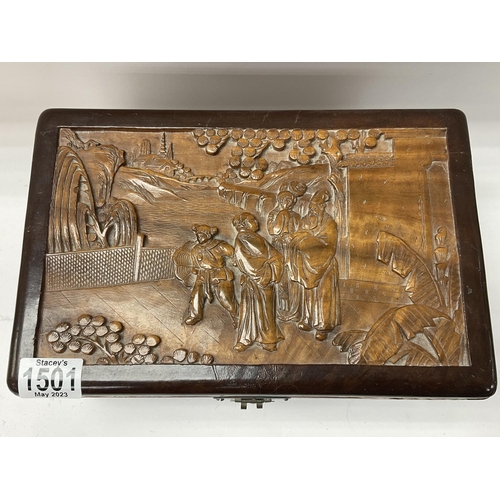 1501 - A small 1920s carved camphor wood lined carved jewellery casket. 30cm x 16cm x 20cm