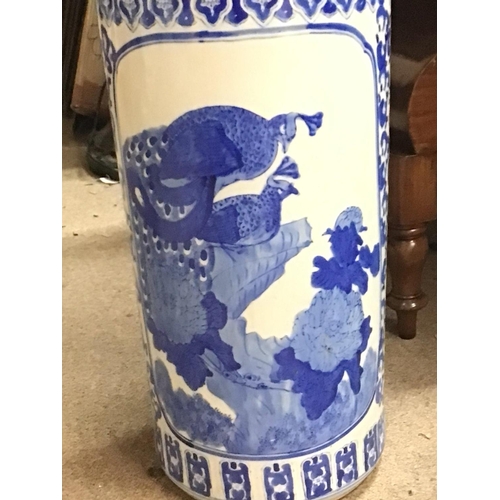 1503 - Ceramic blue and white Umbrella stand with depictions of peacocks and naturalistic scenery (46cm tal... 