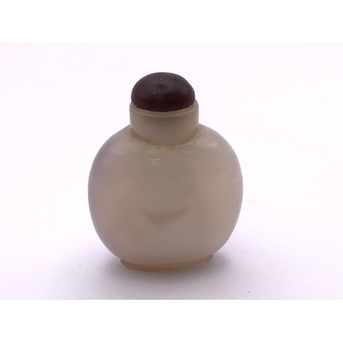 1515 - A polished agate bottle with a natural darkened area in the form of a duck. 4.8cm.