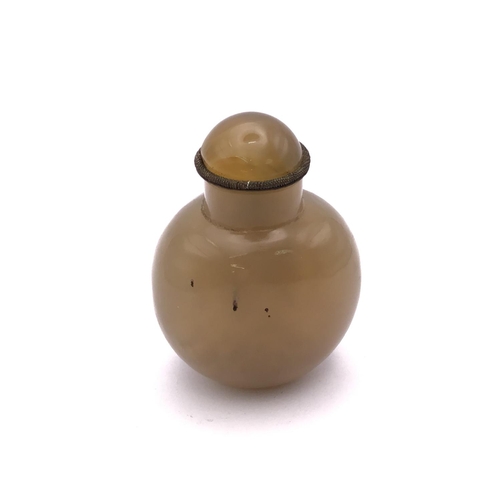 1517 - A polished agate snuff bottle of rounded form, 5cm.