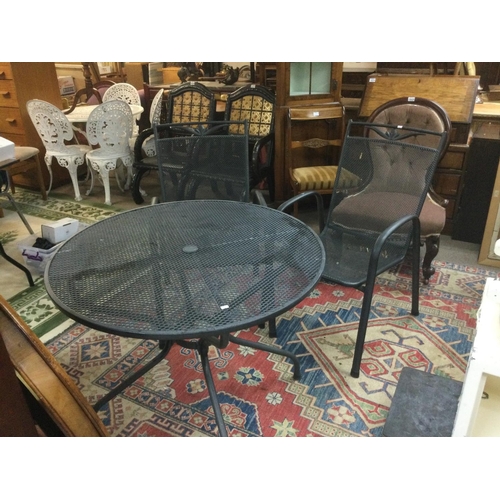 1610 - A modern garden table and two chairs plus some stone garden ornaments. Shipping category D.