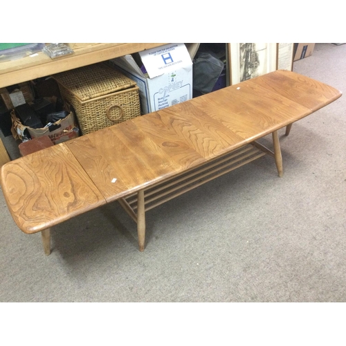 1612 - An Ercol drop leaf table, approx 160cm when extended. Shipping category D.