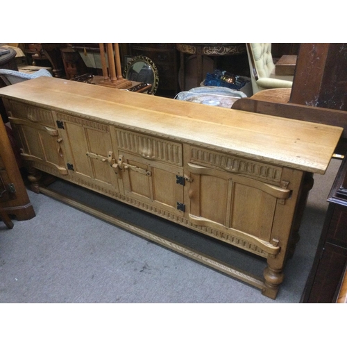 1613 - A light oak sideboard with panelled doors, approx 198cm x 40cm x 76cm. Shipping category D.