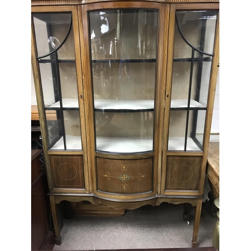 1632 - A Edwardian display cabinet the single door enclosed selfs on square tapering legs ,