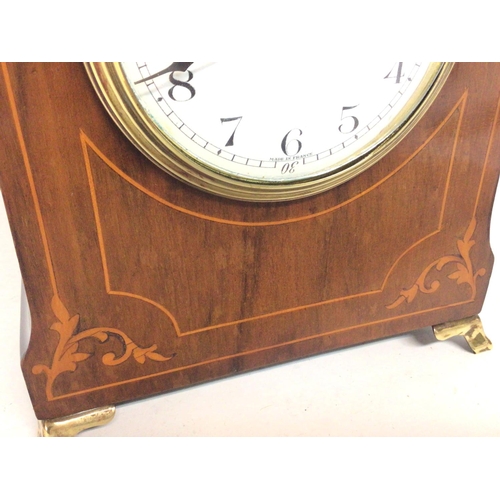 1662 - Edwardian mahogany clock with brass handle and feet with French drum movement, working order. 26cm t... 