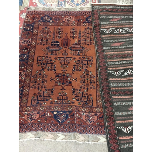 1664 - A hand knotted Middle Eastern rug the geometric patterned rug two turrets and one one other hand kno... 