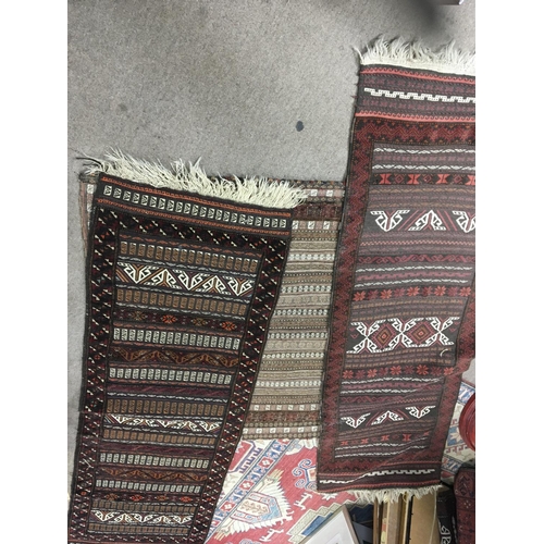 1665 - Three hand knotted rugs two runners both with horizontal repeating patterns. 190x63cm approximately ... 