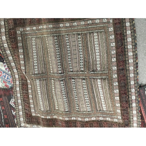 1665 - Three hand knotted rugs two runners both with horizontal repeating patterns. 190x63cm approximately ... 