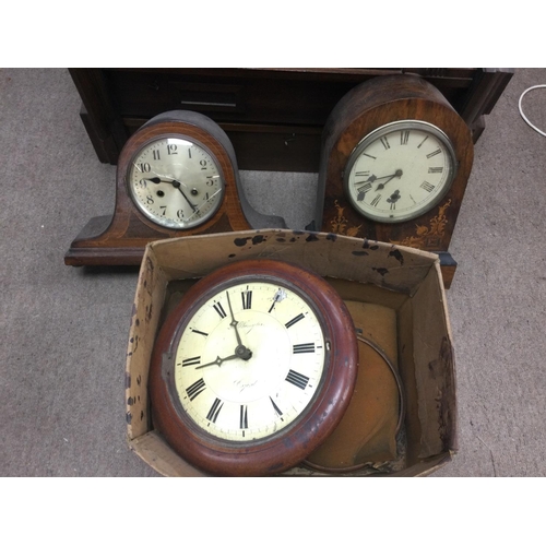 1707 - A mahogany circular wall clock, a parquetry mantle clock and one other. Shipping category D. NO RESE... 