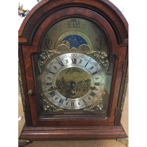 1714 - A Reproduction mahogany manual clock the arched dial with Roman numerals. NO RESERVE