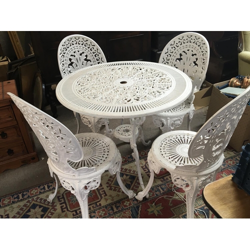 1735 - A white painted cast metal garden table and chairs and a folding gazebo in canvas case